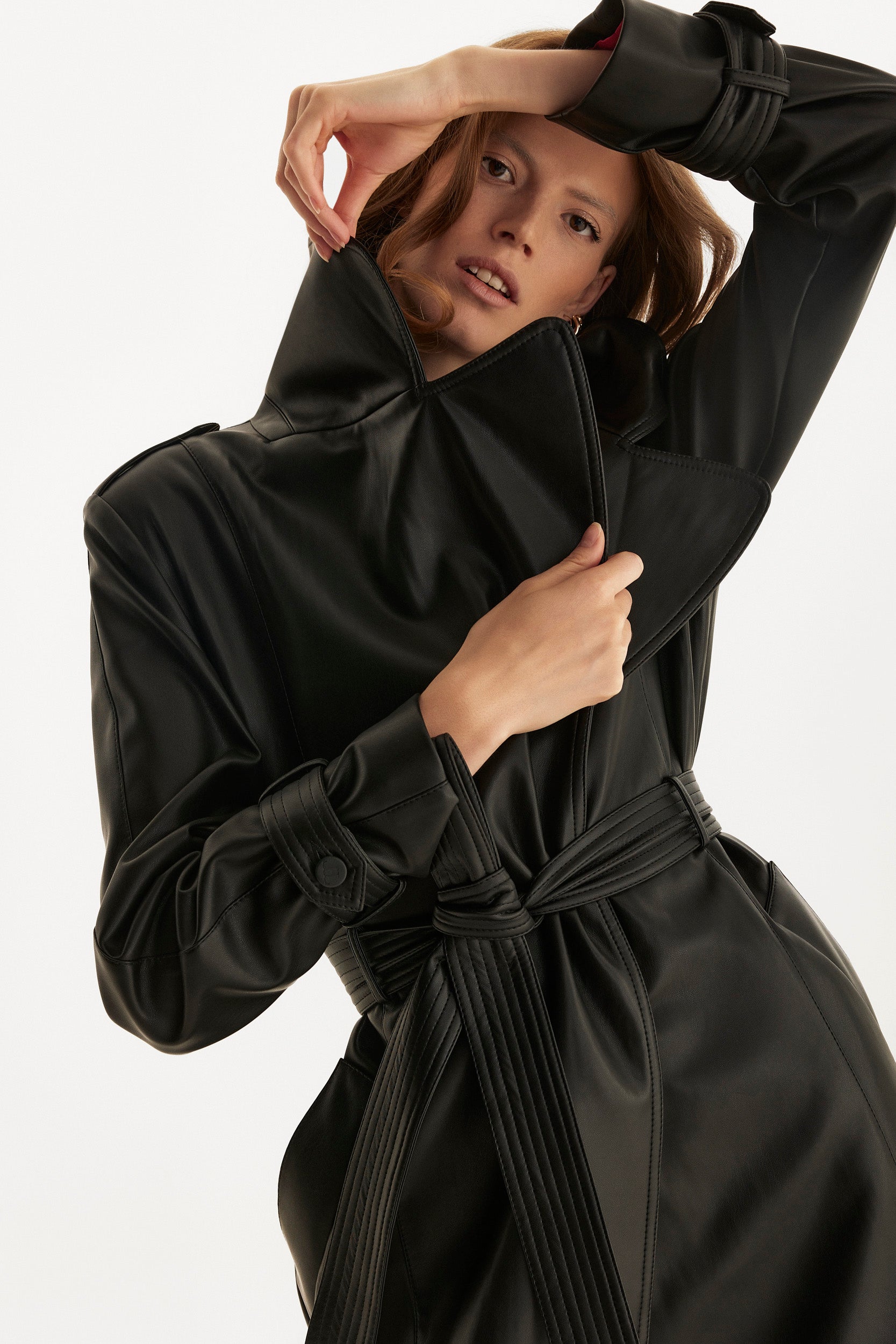 Belted leather trench coat in black