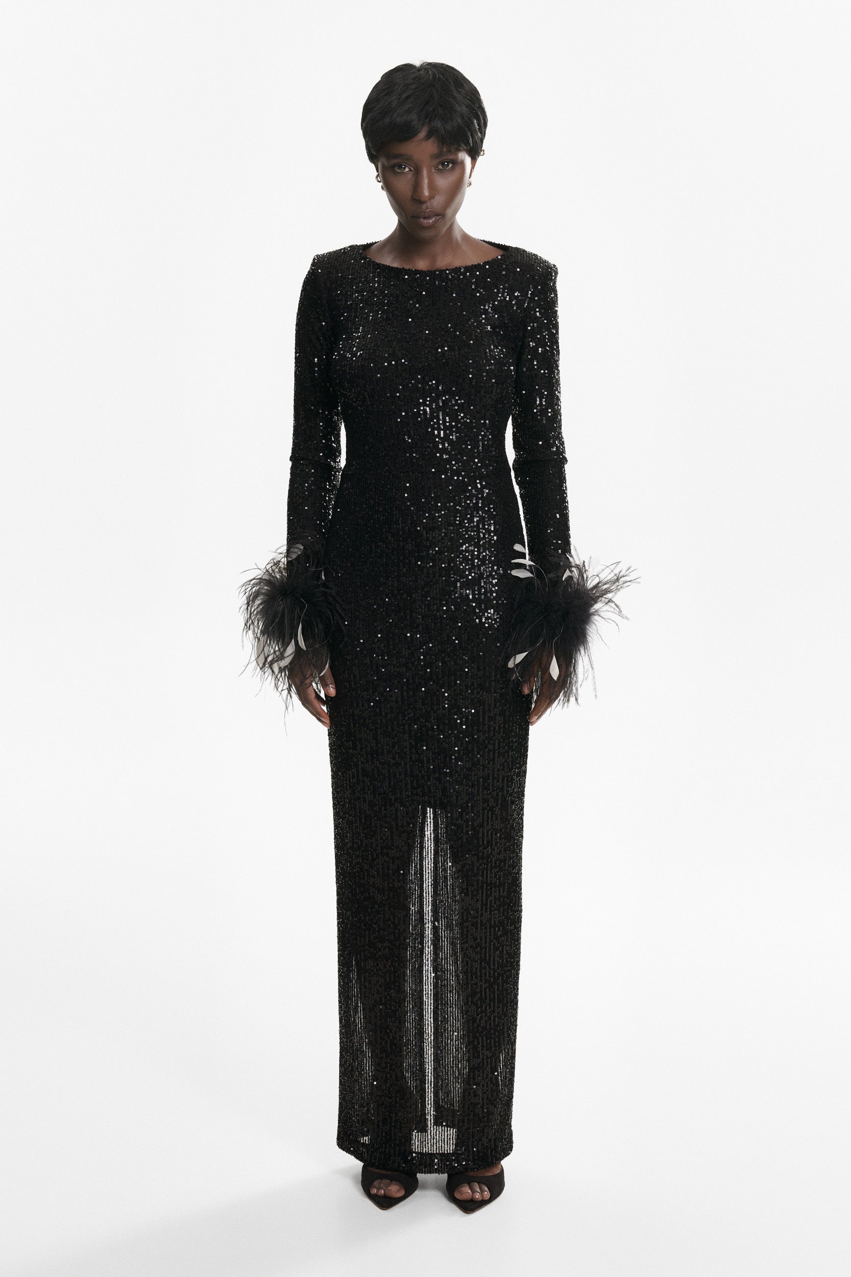 Open-back sequins dress with feathers