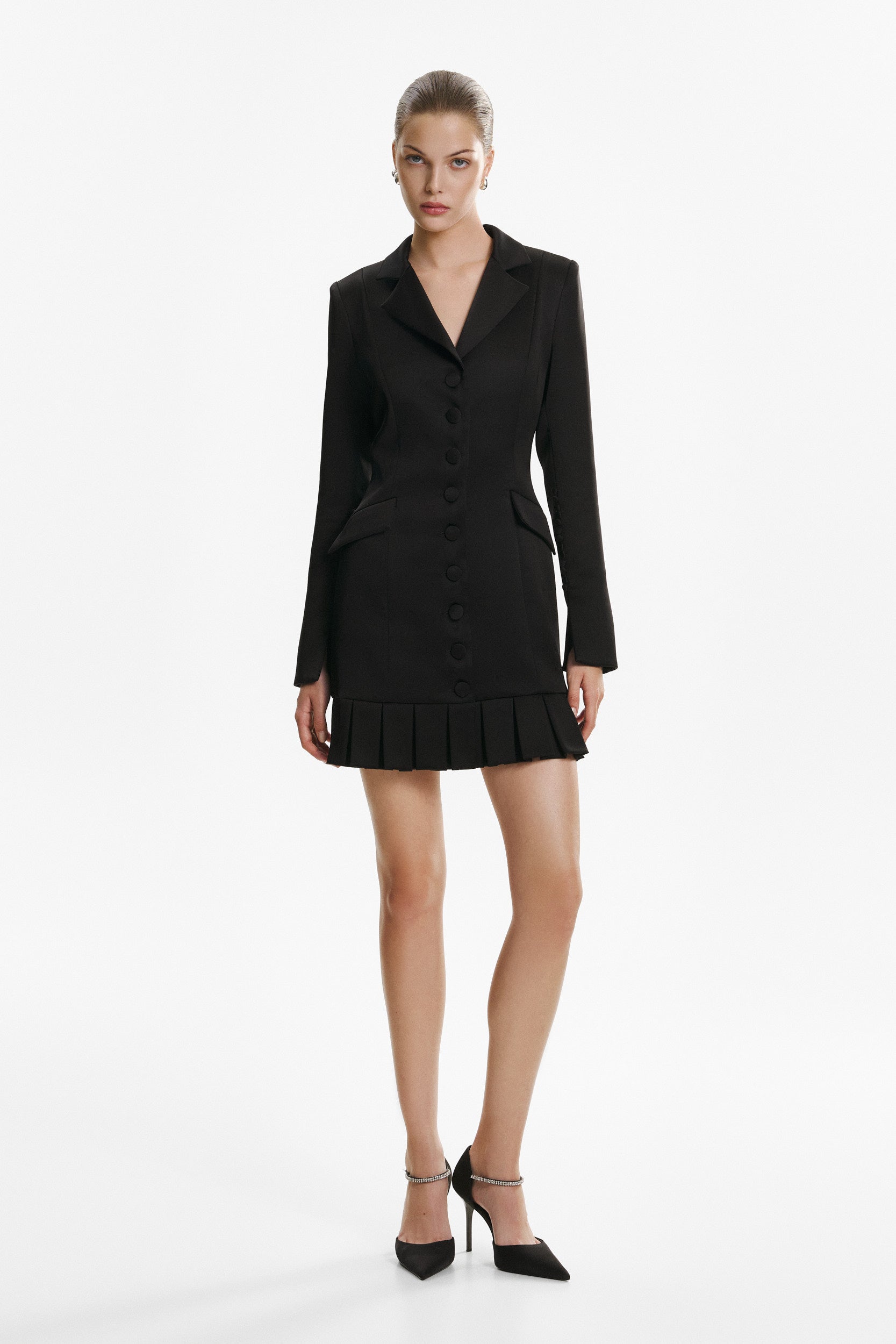 Elegant mini black dress with buttons and pleats