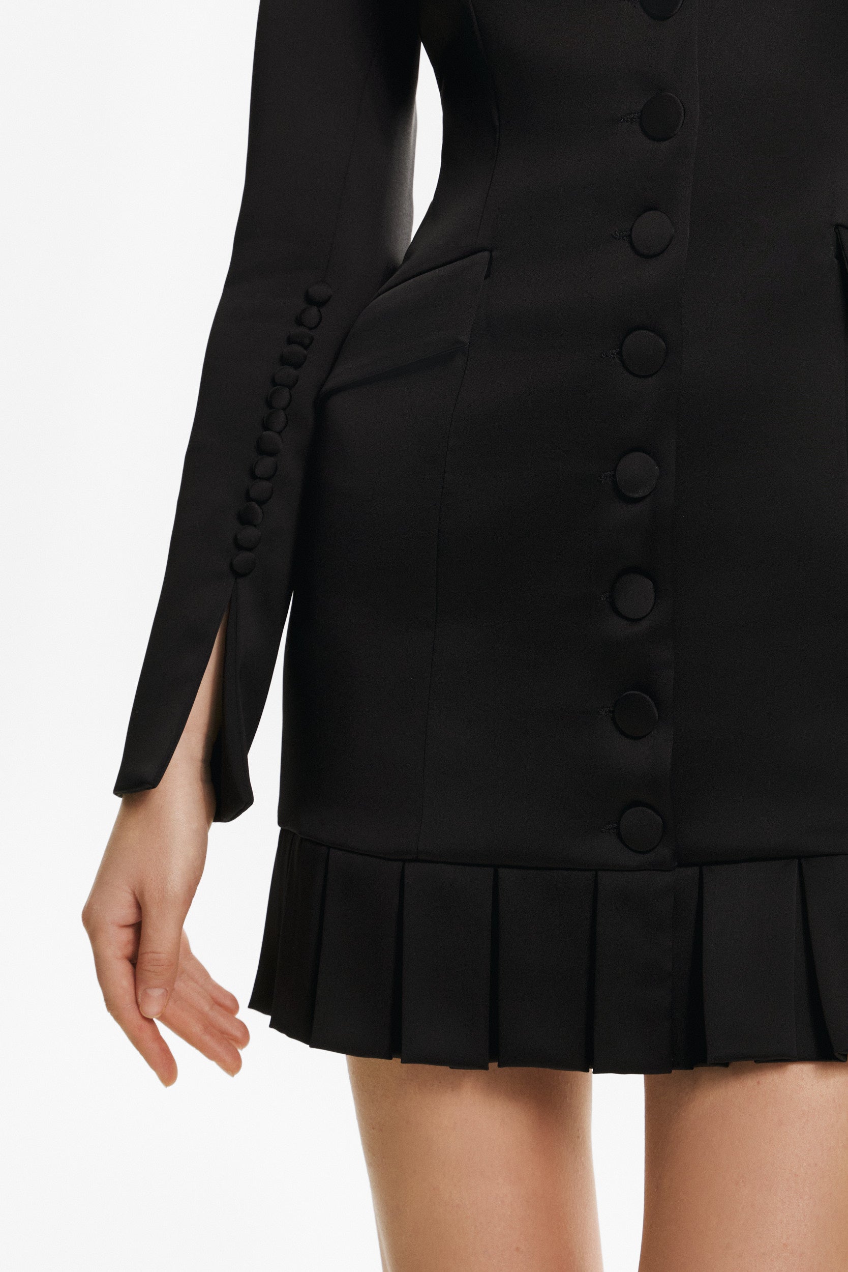 Elegant mini black dress with buttons and pleats