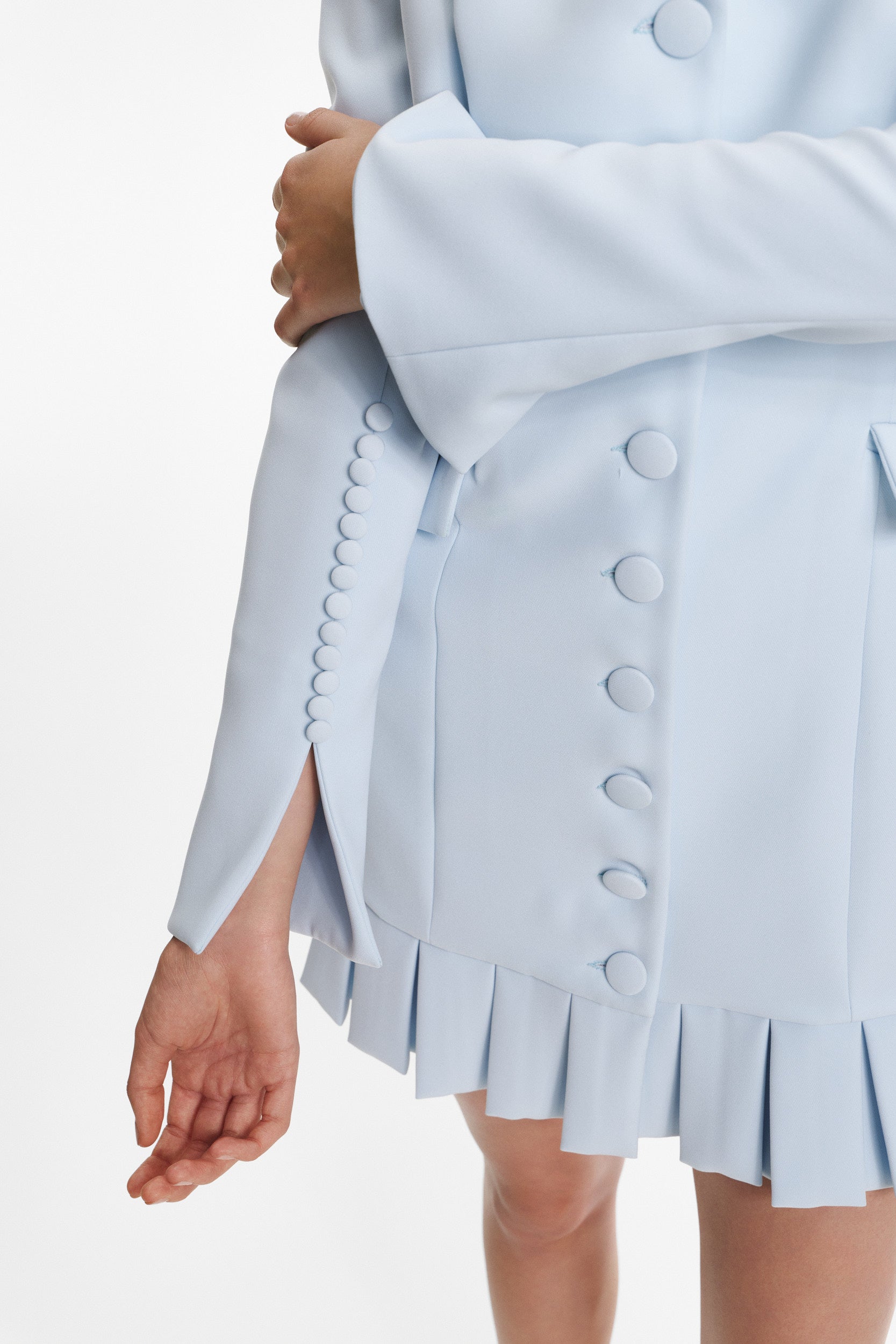 Elegant mini blue dress with buttons and pleats