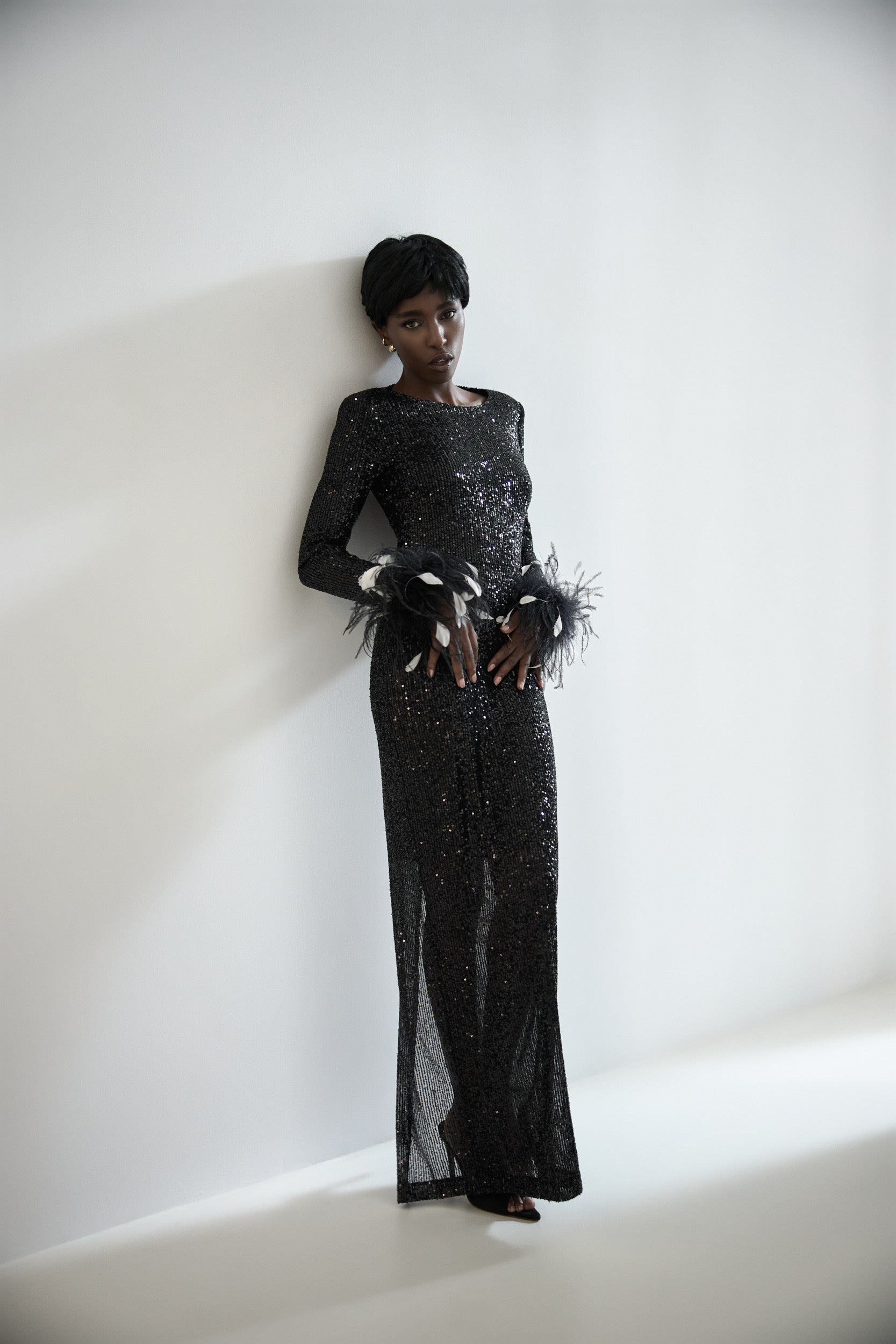 Open-back sequins dress with feathers