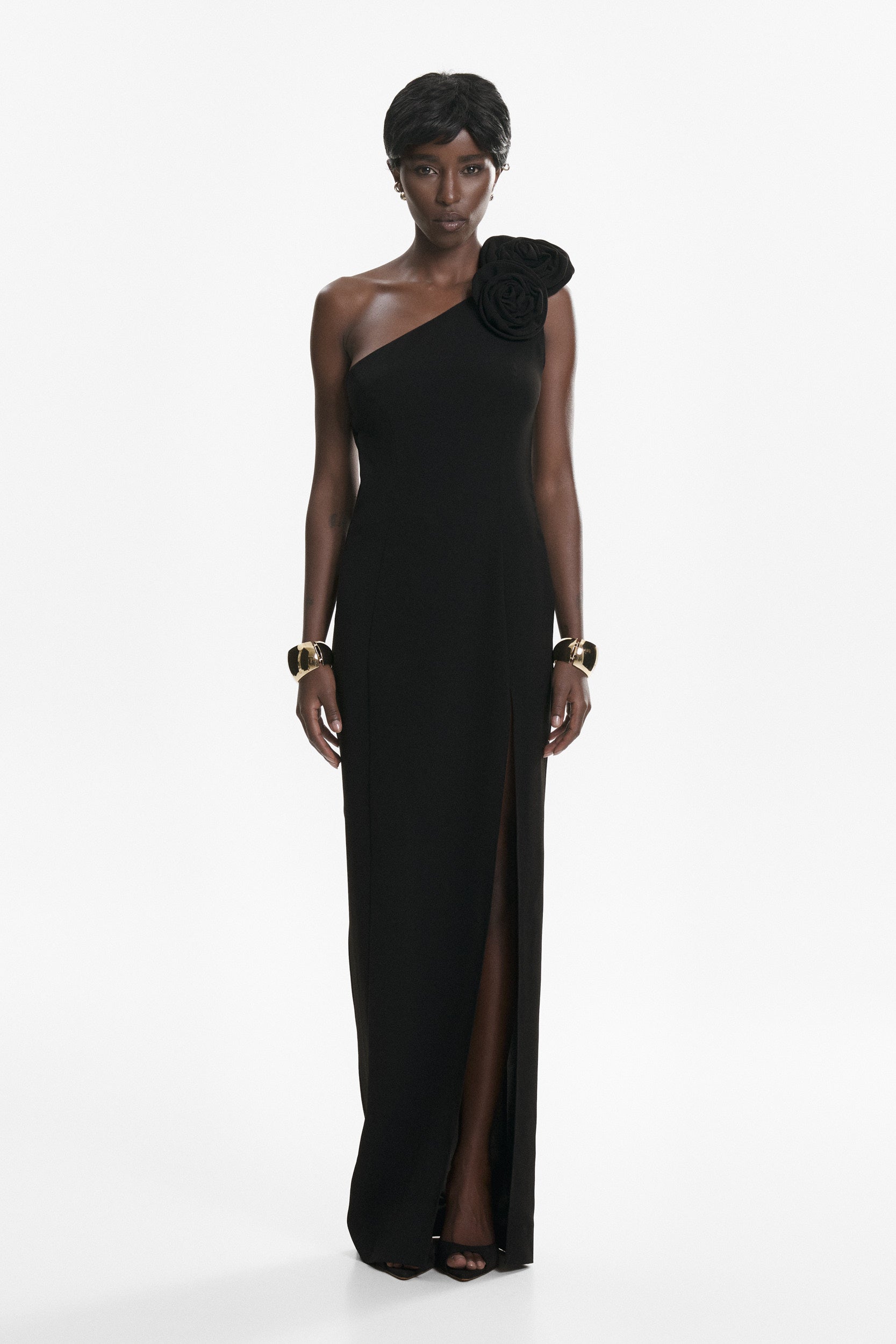 Rosette-appliqué asymmetric crepe dress in black