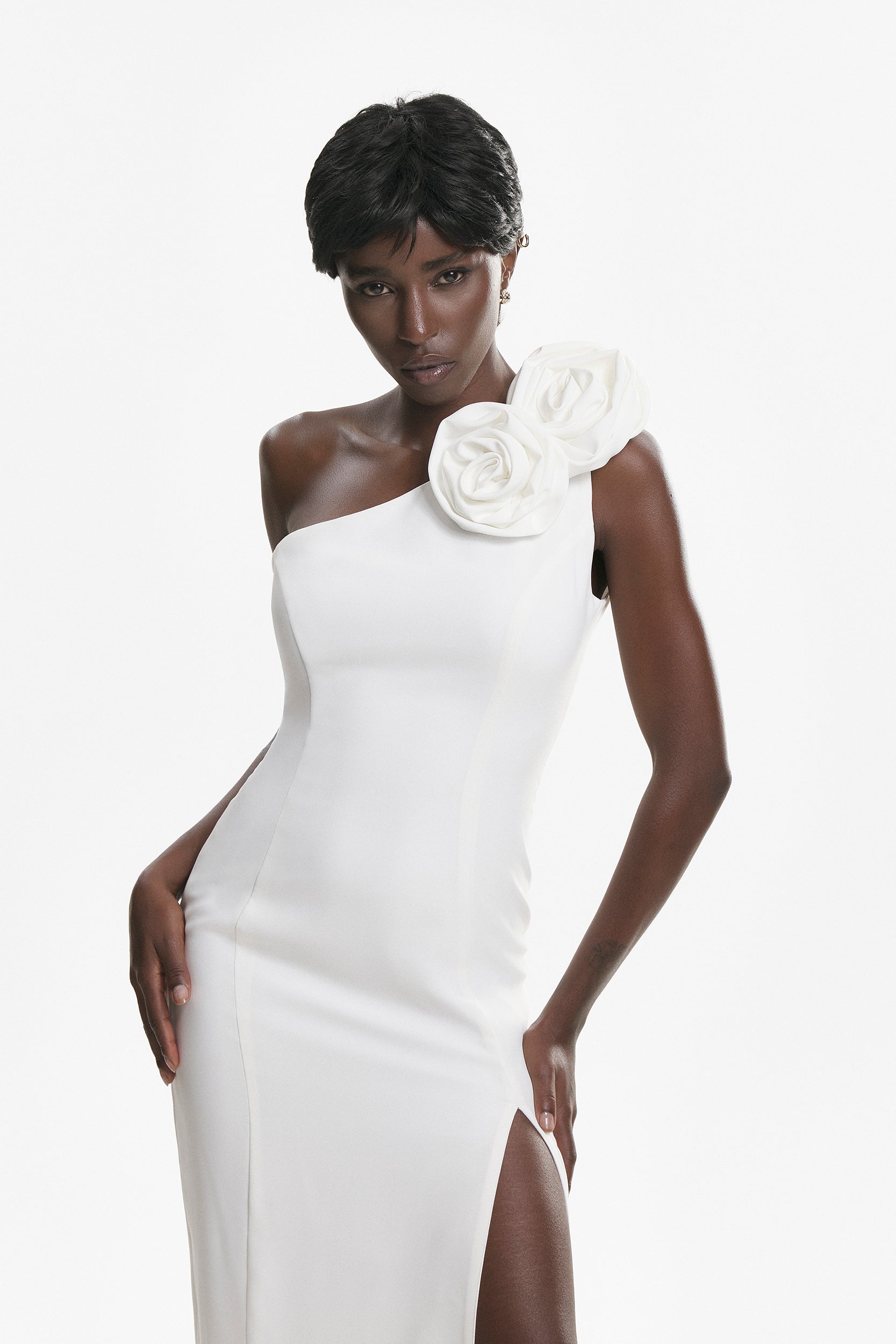 Rosette-appliqué asymmetric crepe dress in white
