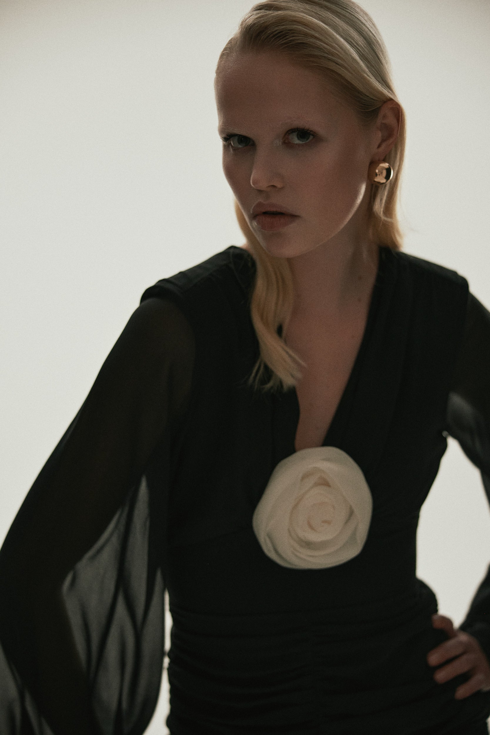 Ruched floral-appliqué black dress