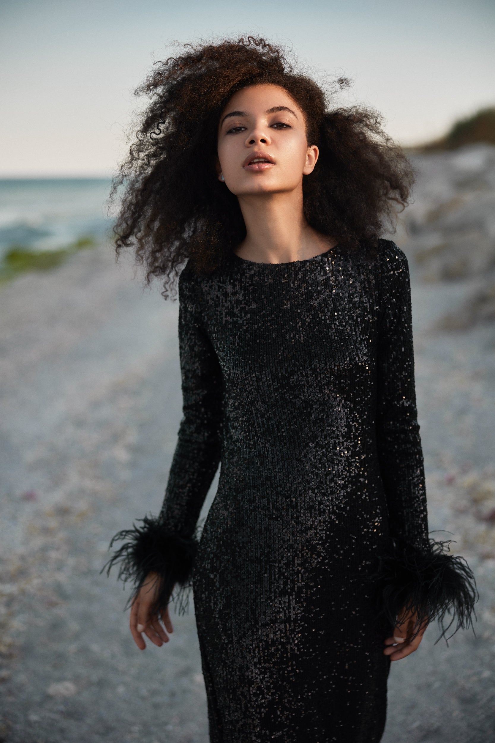 Open-back sequins dress with feathers in black