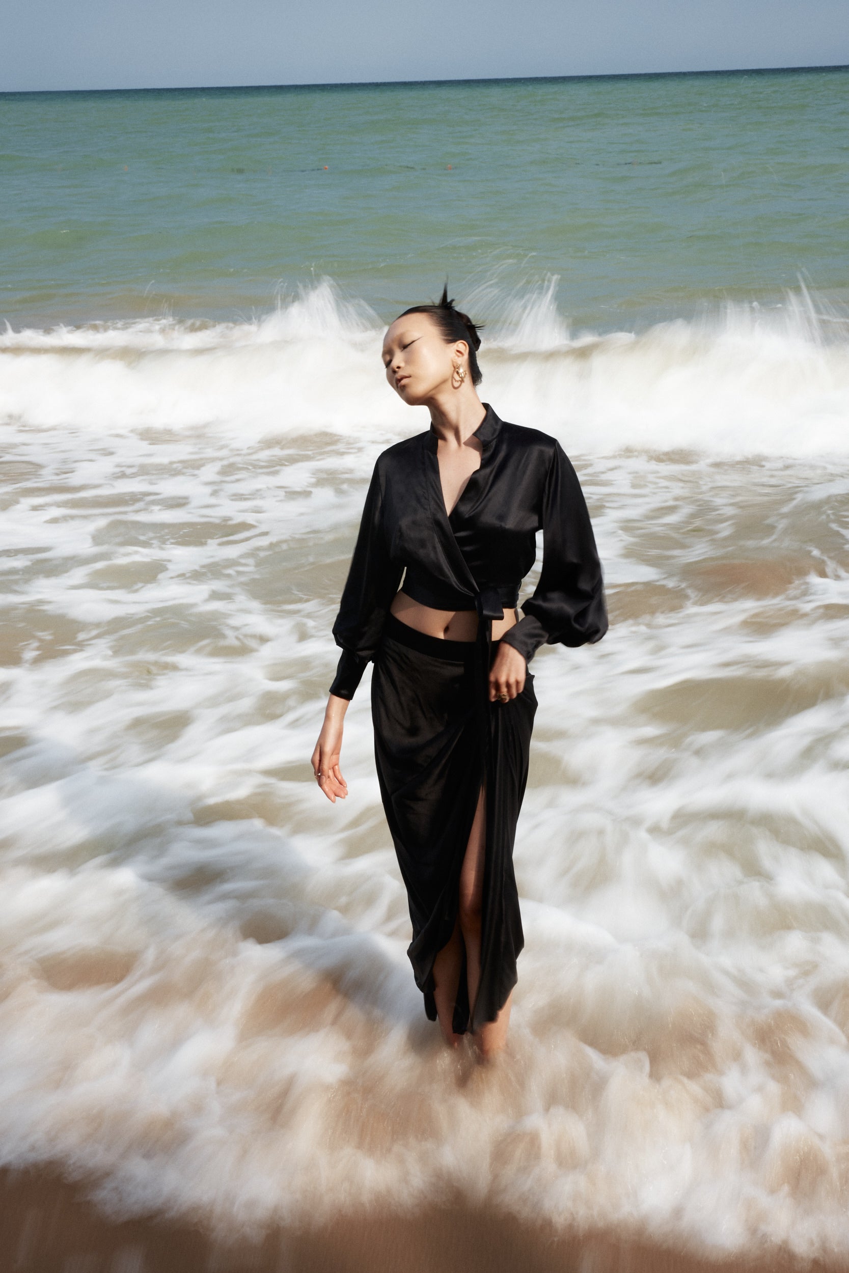 Side-slit midi skirt in black