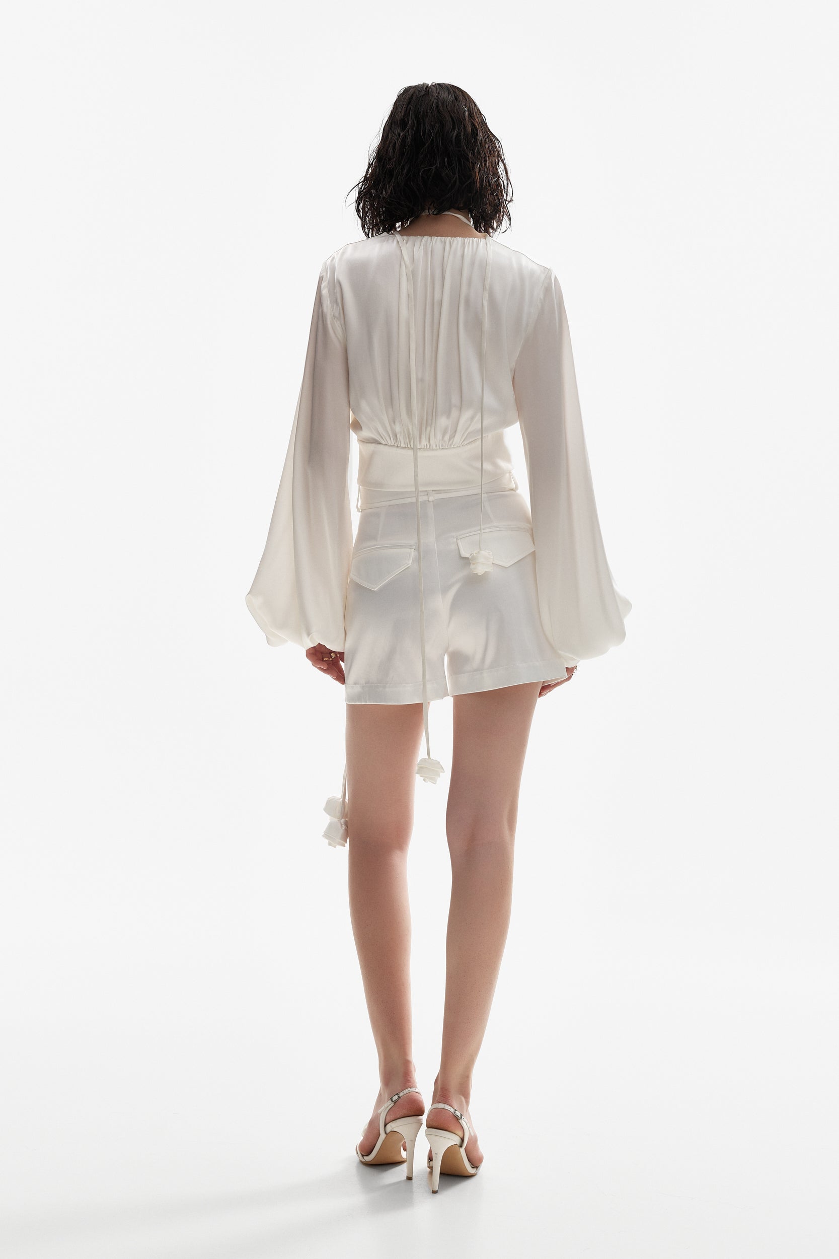 Satin shorts with rosettes in white