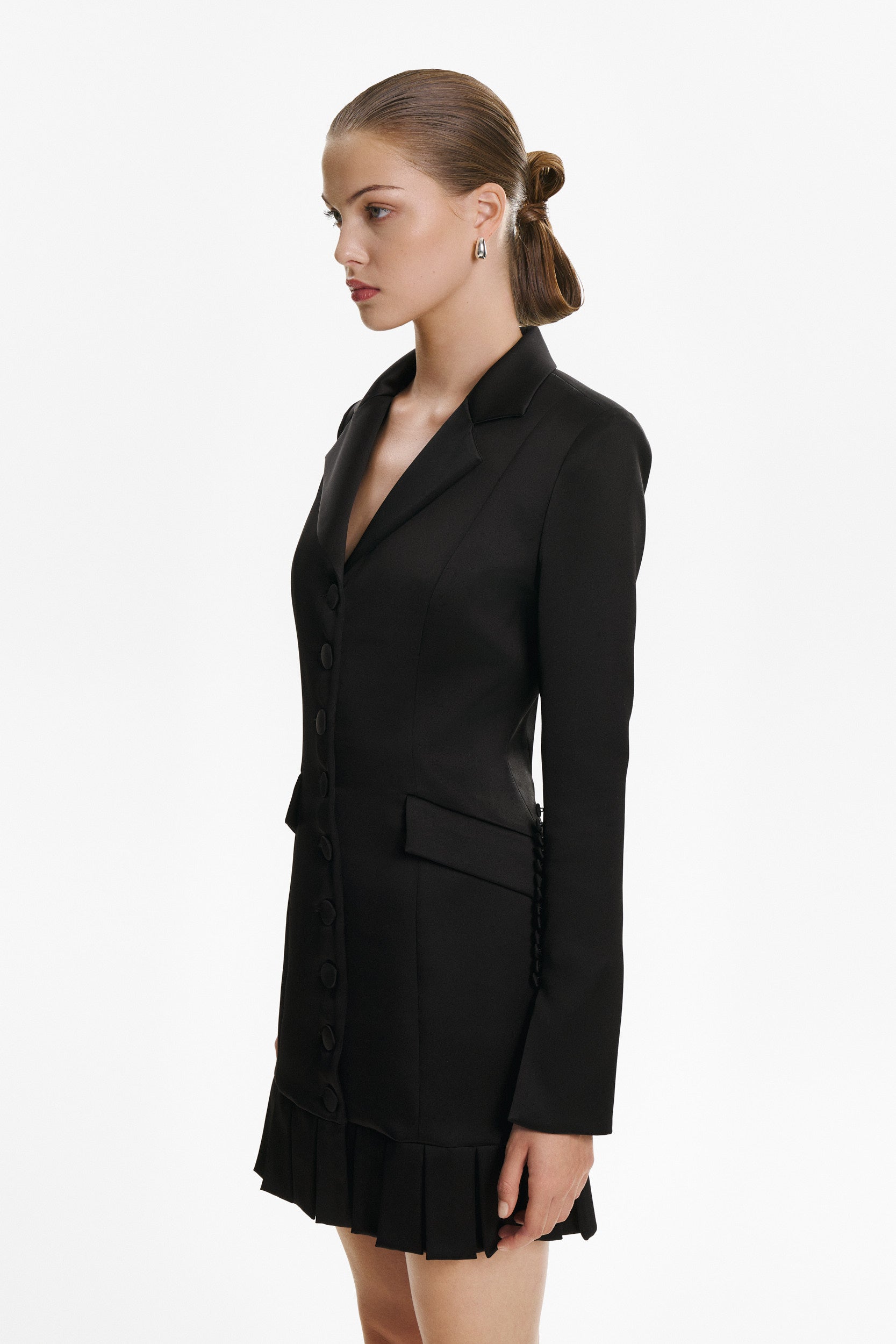 Elegant mini black dress with buttons and pleats