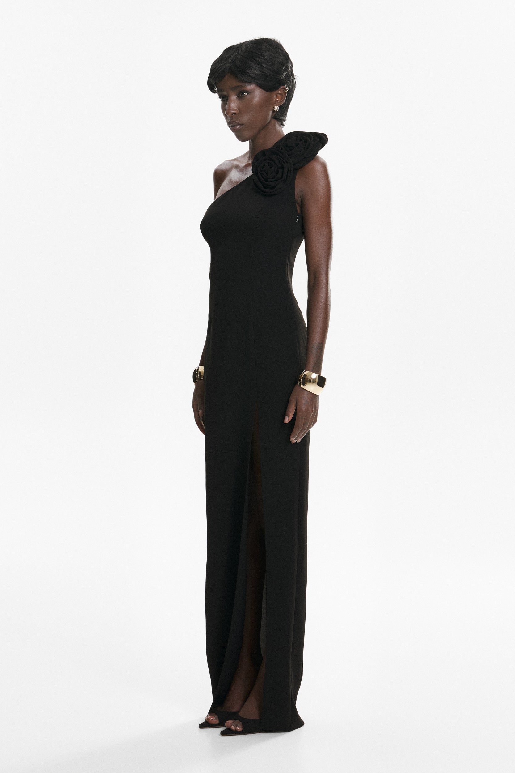 Rosette-appliqué asymmetric crepe dress in black