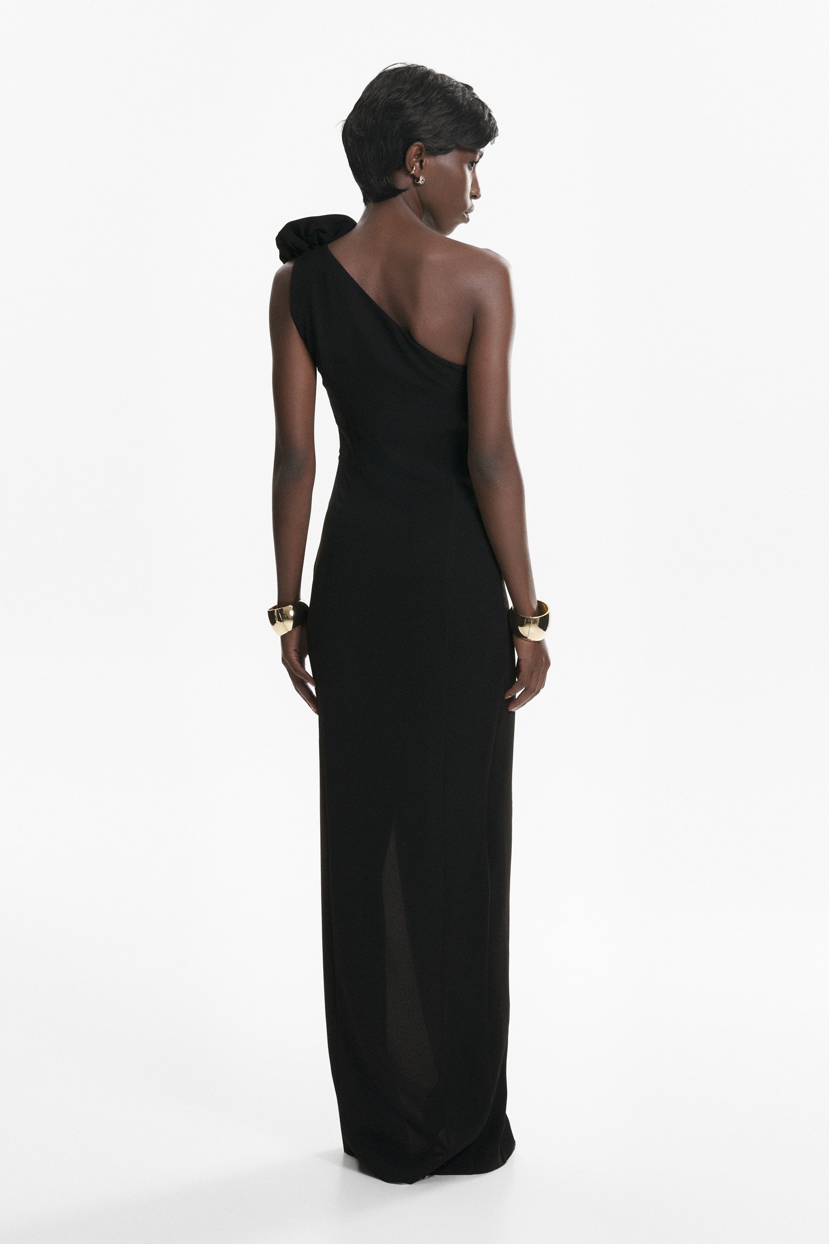 Rosette-appliqué asymmetric crepe dress in black