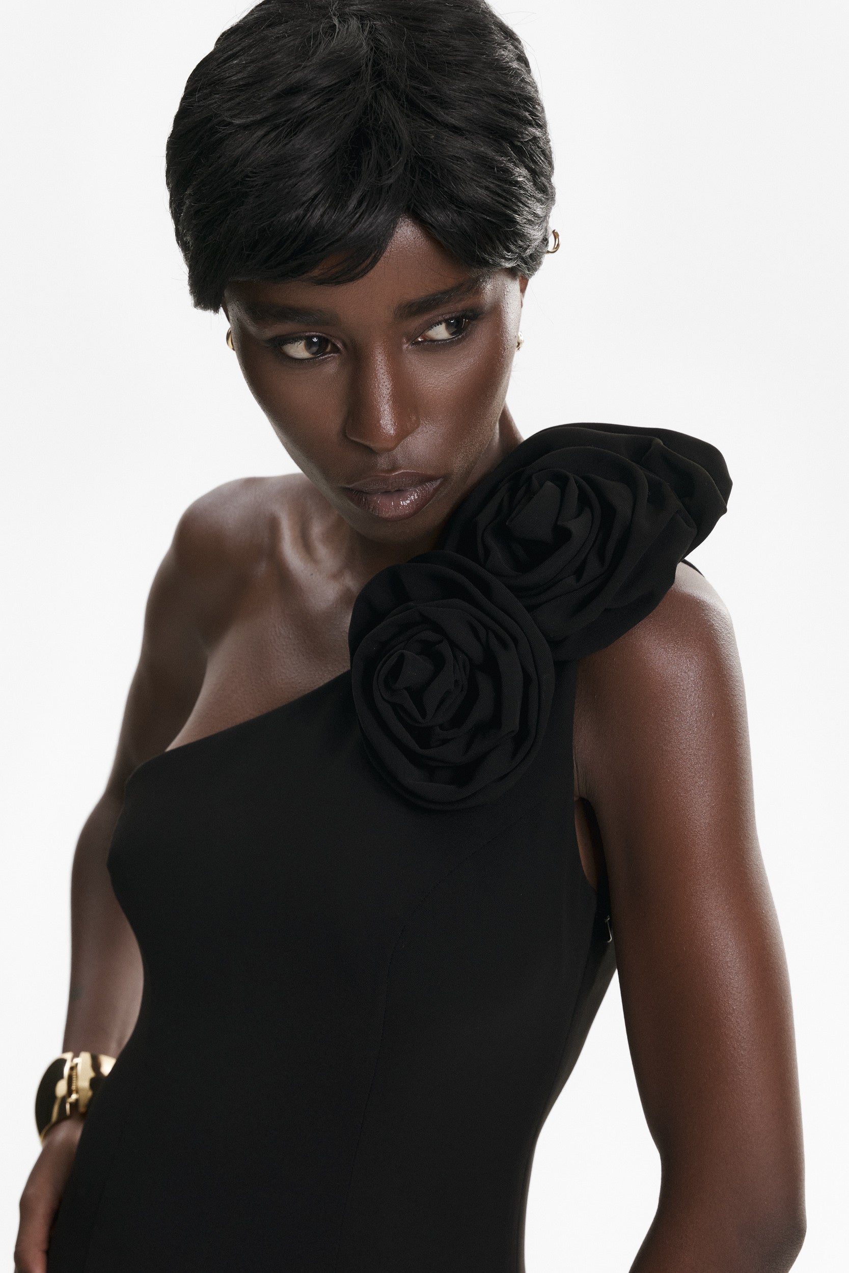 Rosette-appliqué asymmetric crepe dress in black