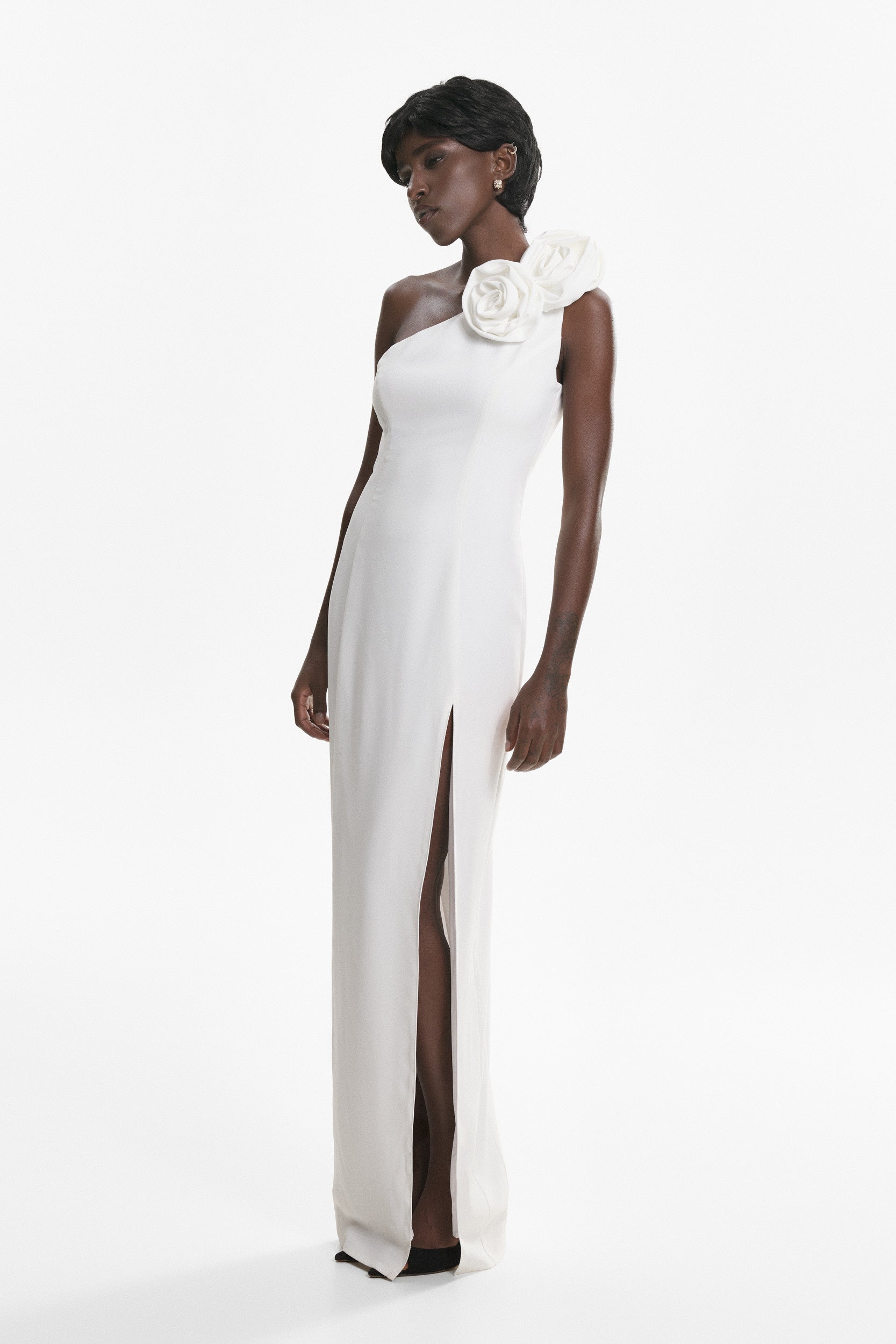 Rosette-appliqué asymmetric crepe dress in white