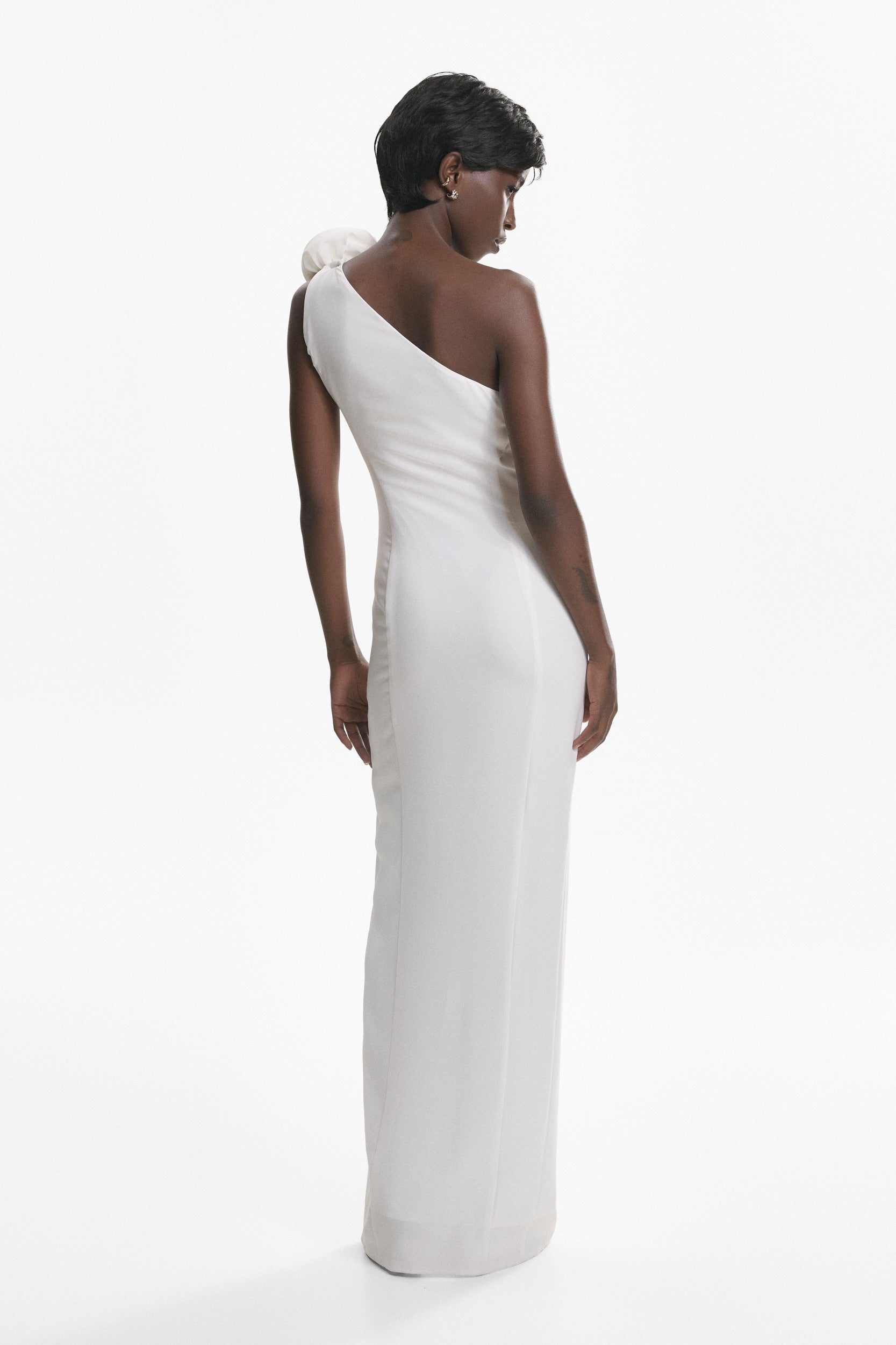 Rosette-appliqué asymmetric crepe dress in white