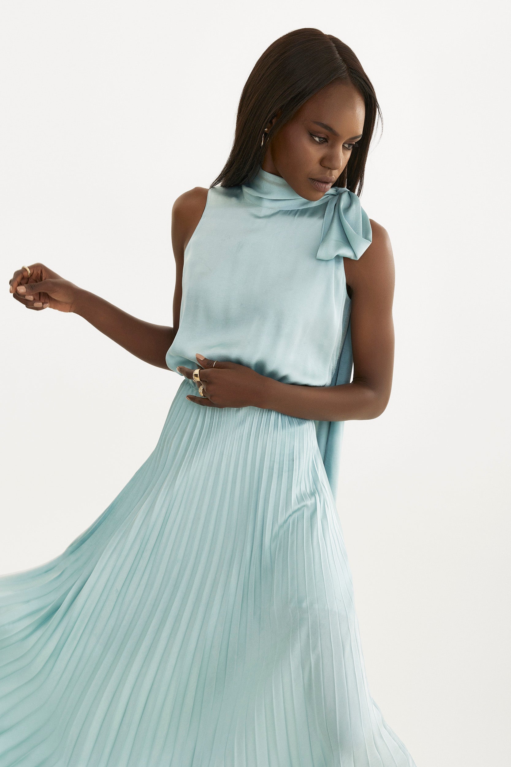 Pleated dress in light blue with tie-shoulder detail